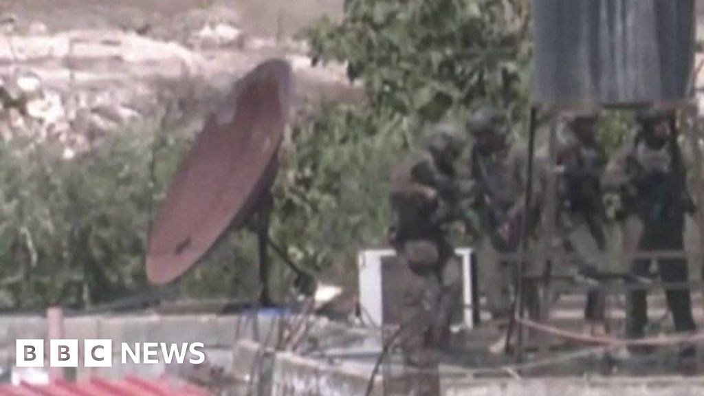 Israel investigates after soldiers filmed throwing bodies from roof