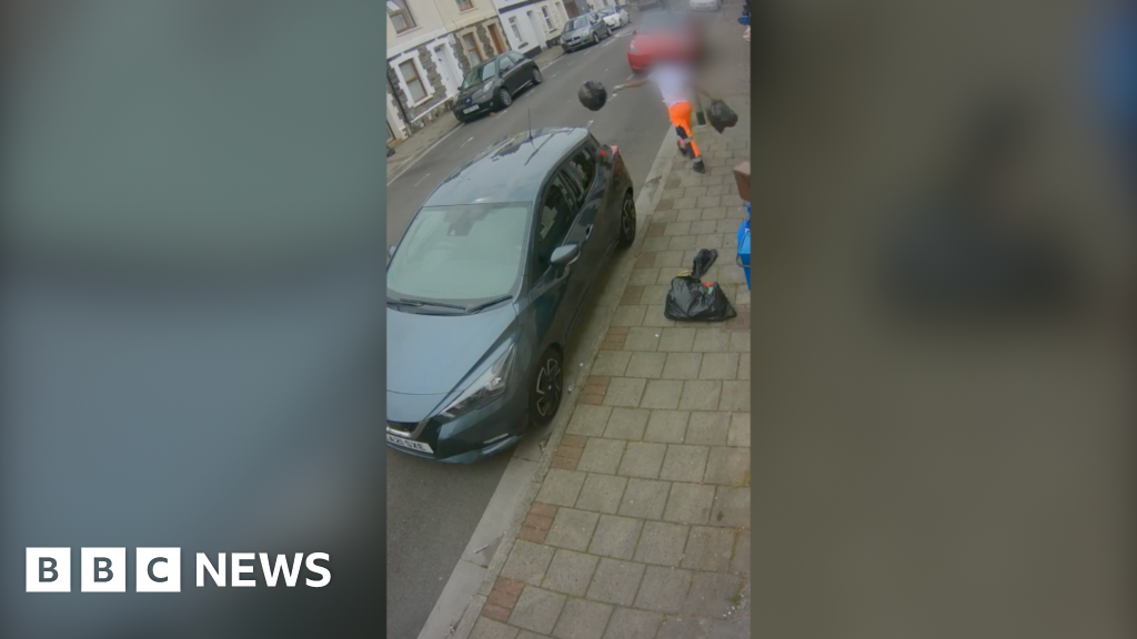 Watch: Bin man seen on CCTV dropping rubbish bags