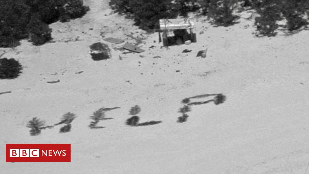 Os marinheiros resgatados de ilha após escreverem 'socorro' na praia