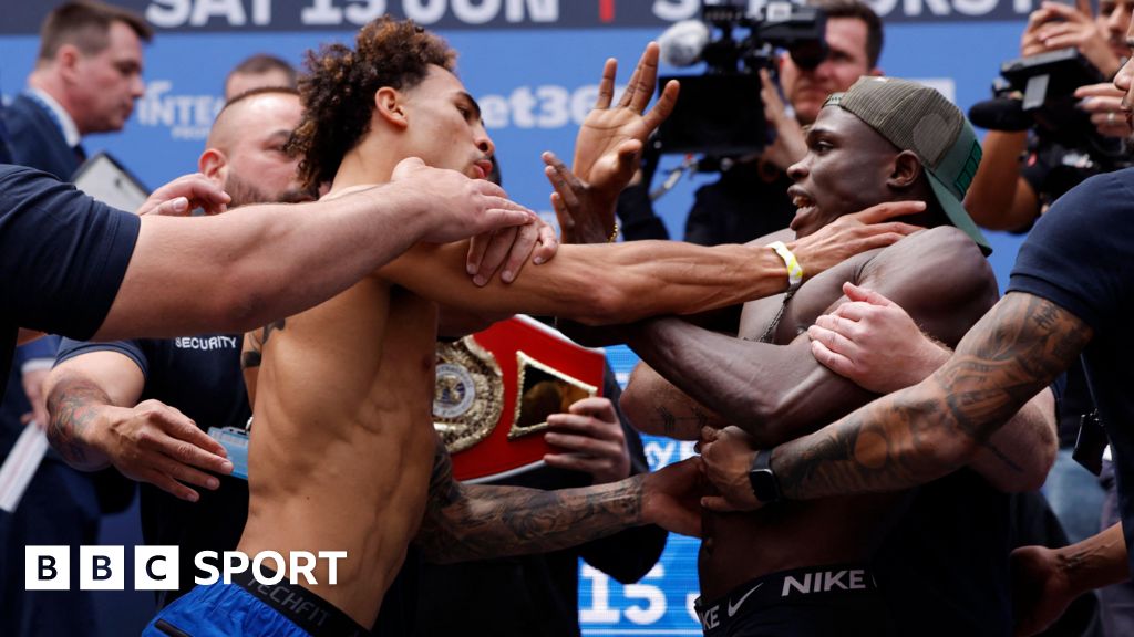 Whittaker grabs opponent's throat at weigh-in