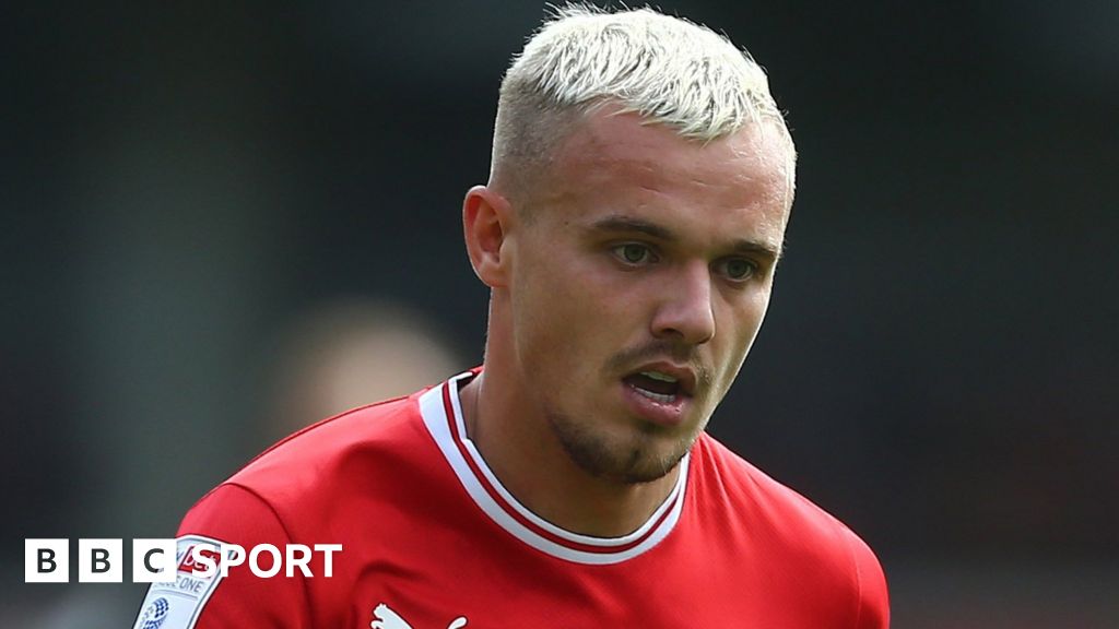 Luke Thomas: Barnsley forward out for four months with double leg fracture  - BBC Sport