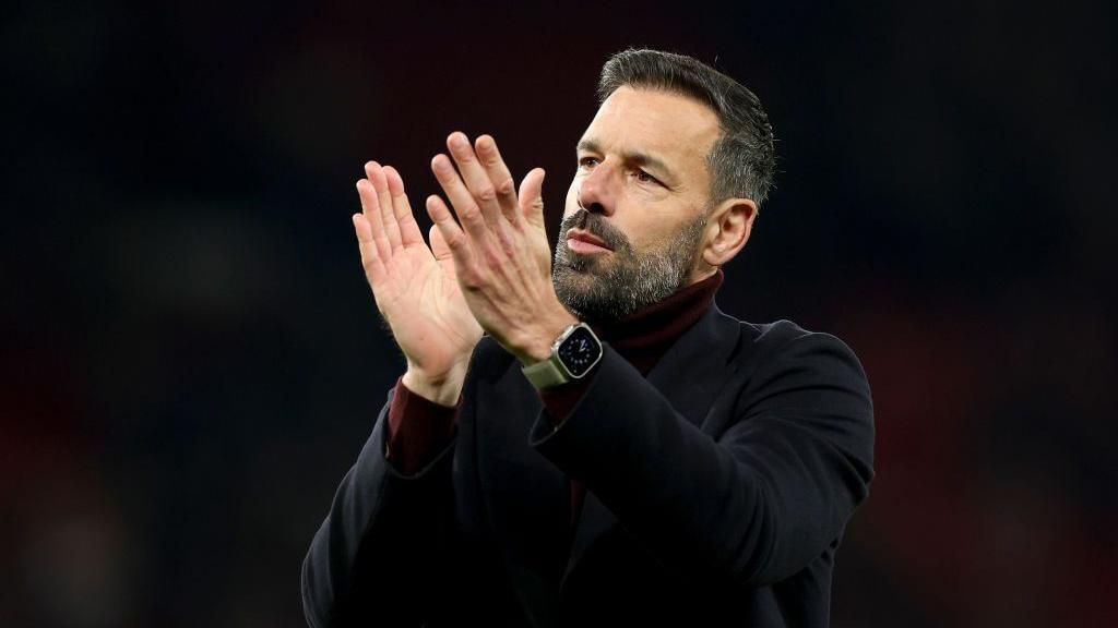 Ruud van Nistelrooy applauds Manchester United supporters.