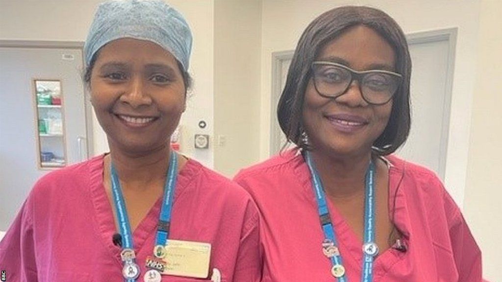 NHS workers Jayanthy John and Rose Amankwaah pictured in their uniforms