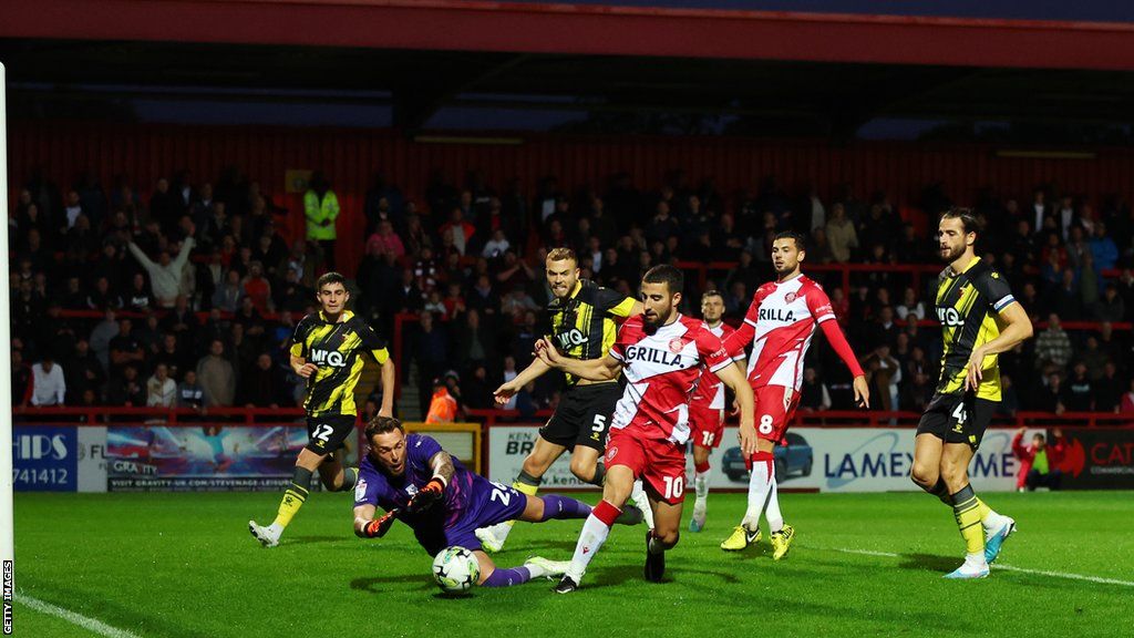 Stevenage force Watford's goalkeeper to make a save during their Carabao Cup tie