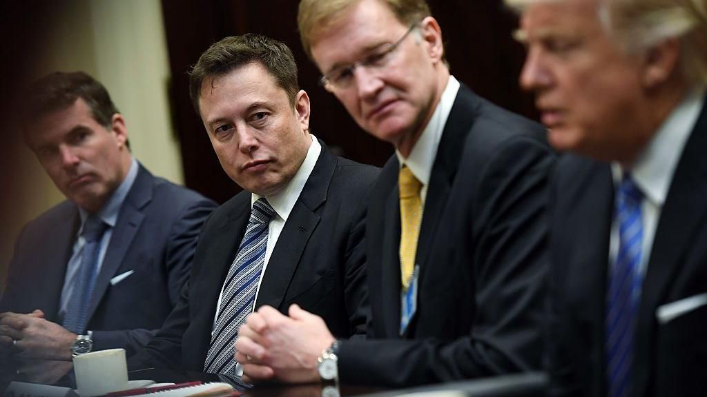 Elon Musk, left center, and Wendell P. Weeks, right center, listen to President Donald Trump, right, as he meets with business leaders at the White House on Monday January 23, 2017 in Washington, DC.