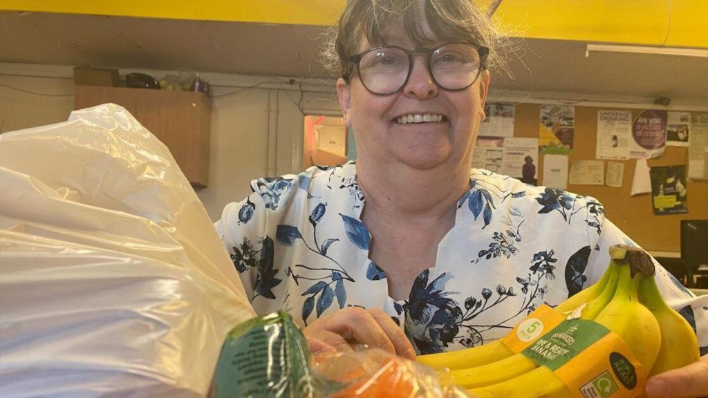 Penny Walters, 57, from Byker, with food including bananas and carrots