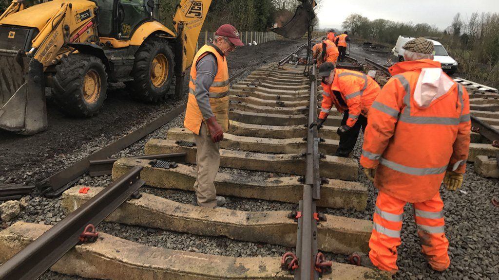 Volunteers dropping in the rails