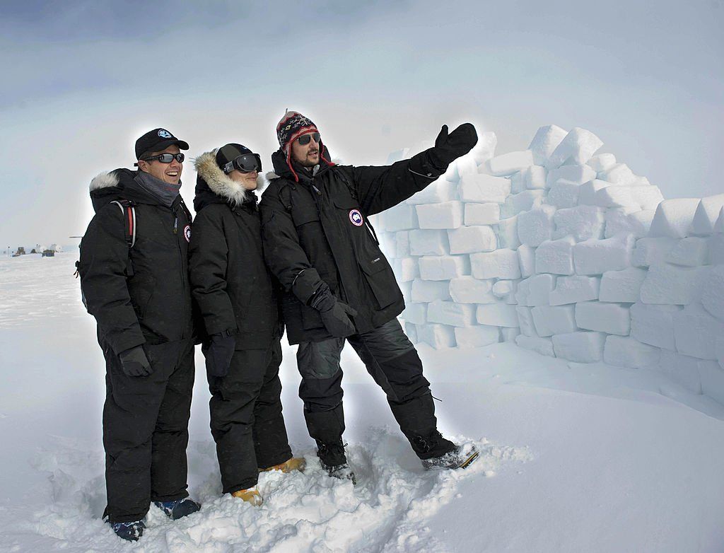 Prince Frederik of Denmark, Princess Victoria of Sweden, and Prince Haakon of Norway standing in the snow in Greenland