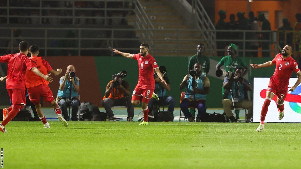 Tunisia's Hamza Rafia celebrates scoring their first goal in football Africa Cup of Nations 2023 Group E, playing against Mali at the Stade Amadou Gon Coulibaly in Ivory Coast