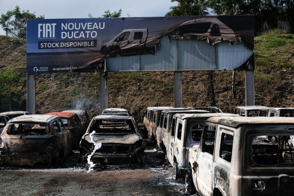 Burnt cars at a car dealer store in Noumea on May 14, 2024