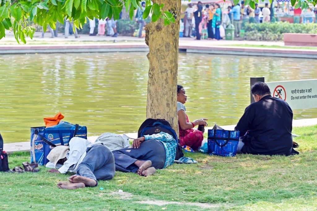 NEW DELHI, INDIA - MAY 12: Visitors seen out on a hot afternoon at India Gate, on May 12, 2024 in New Delhi, India. (Photo by Sanjeev Verma/Hindustan Times via Getty Images)
