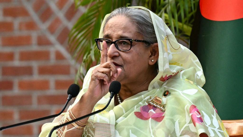 Sheikh Hasina holding a finger to her face