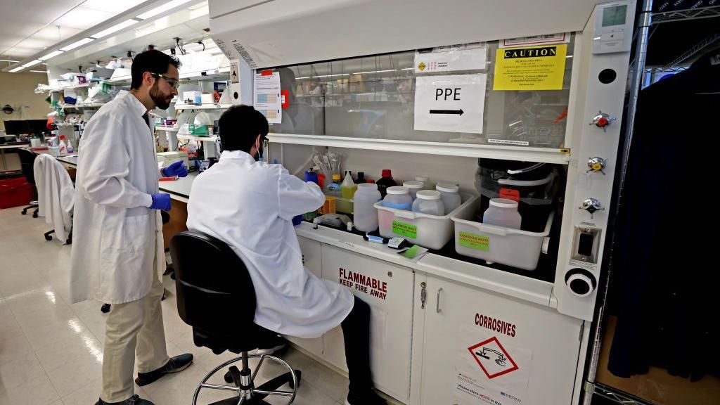 Scientists testing store-bought milk in a lab