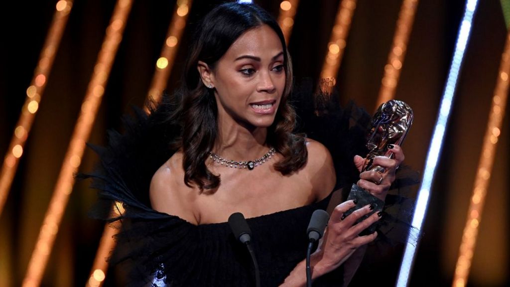 Zoe Saldaña accepts the Supporting Actress Award for 'Emilia Pérez' on stage during the EE BAFTA Film Awards 2025 at The Royal Festival Hall on February 16, 2025 in London, England