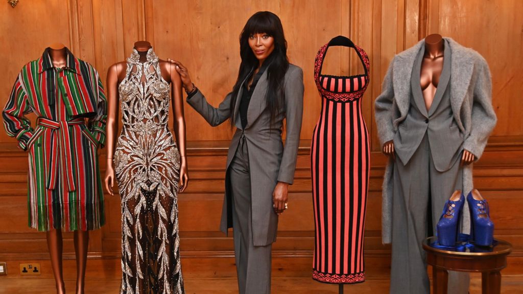 Naomi Campbell with outfits from the V&A exhibition