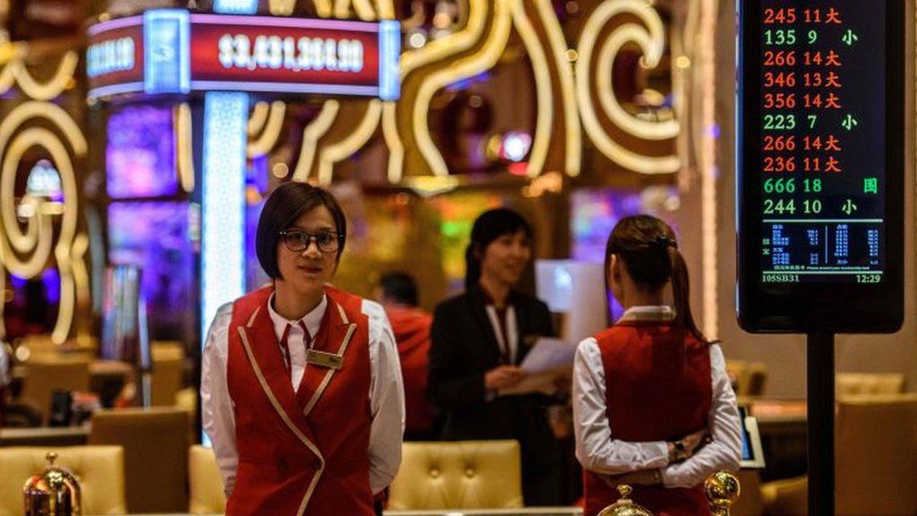 Members of staff prepare for the opening of the casino at the MGM Cotai resort in Macau.