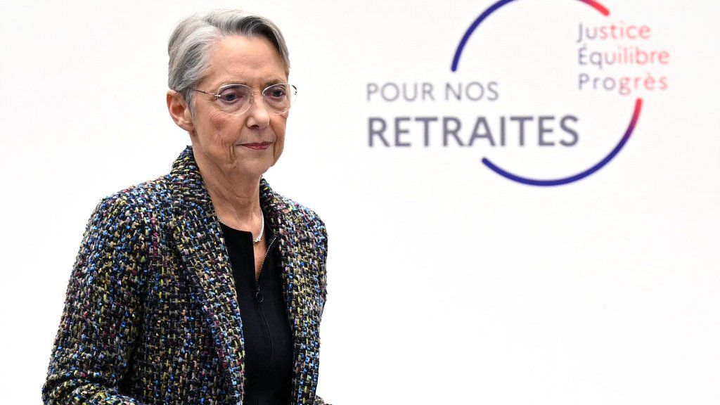 France's Prime Minister Elisabeth Borne walks off the stage after presenting the government's plan for a pension reform during a press conference in Paris on 10 January 2023