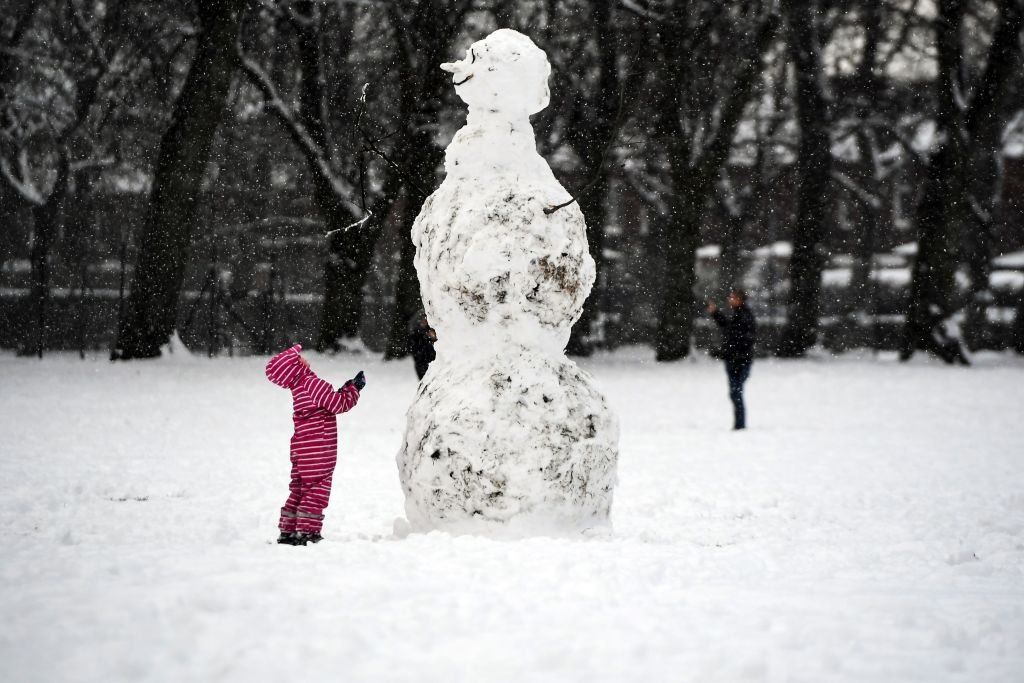 Child and a snowman