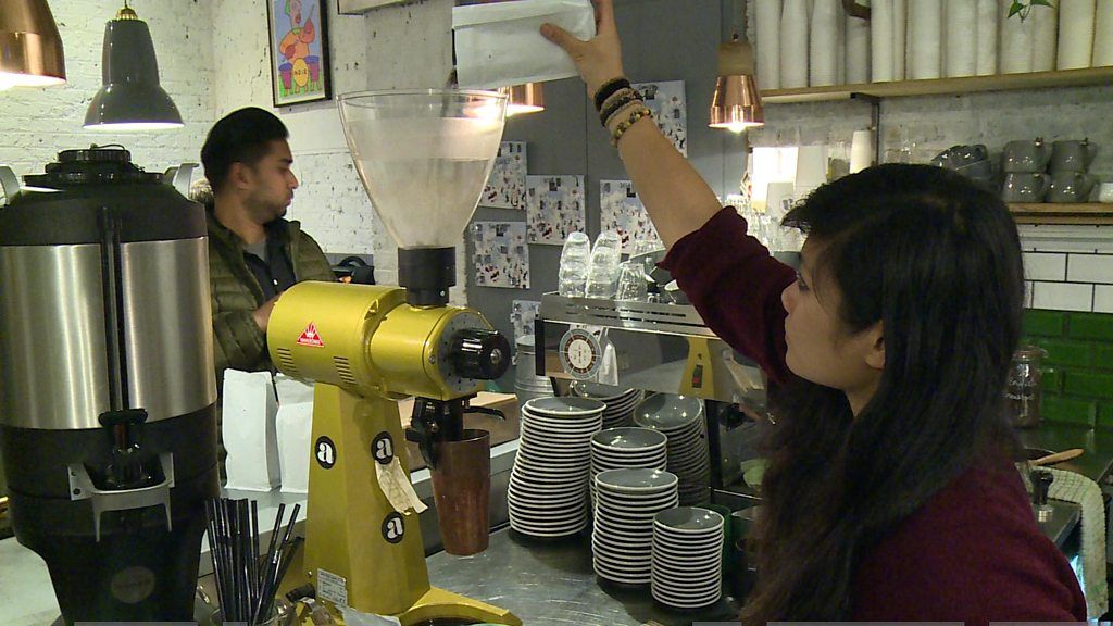 A barista making coffee