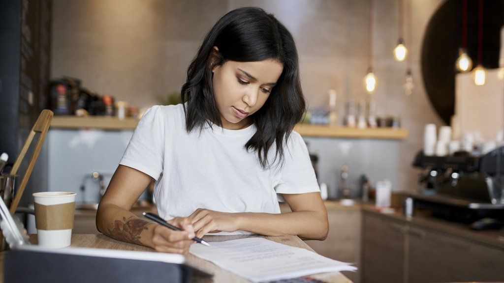 Woman calculating her taxes