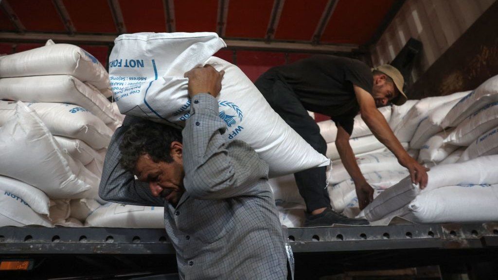 UN aid unloaded from a truck near Bab al-Hawa (file photo)