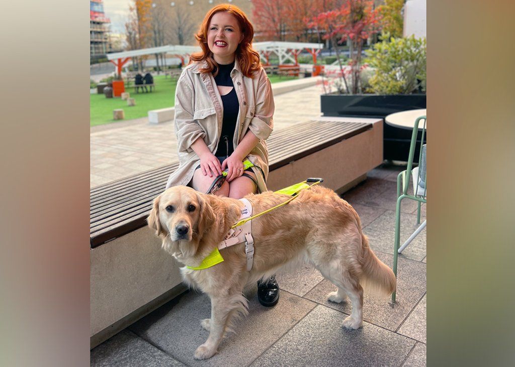 Lucy in London with her guide dog Molly