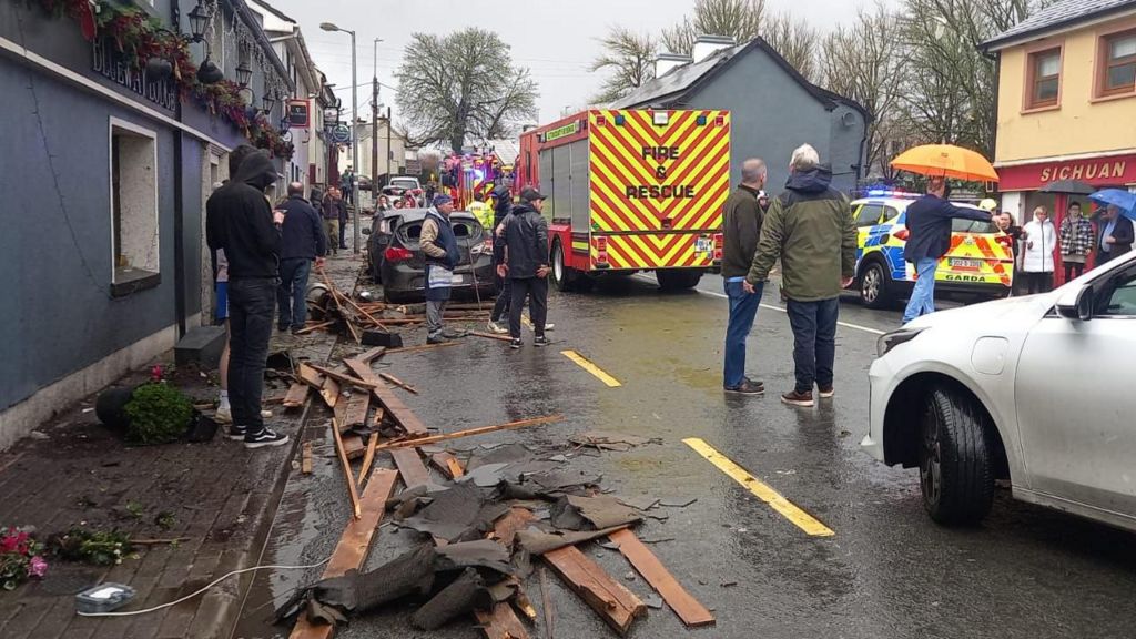 Damage in Leitrim Village with emergency vehicles in background
