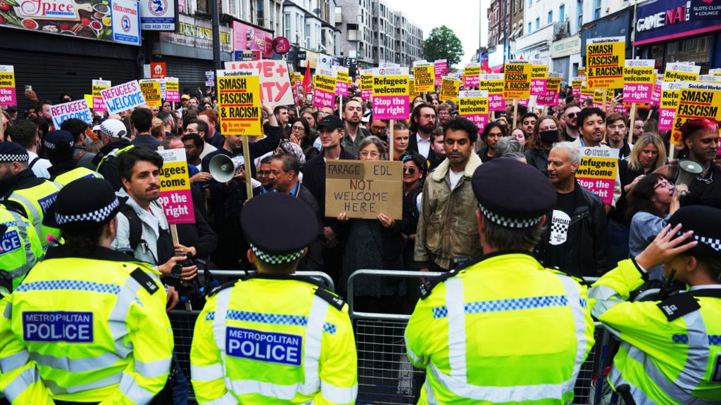 Thousands of counter-protesters to a proposed far-right demonstration gathered in Walthamstow on a street outside an immigration centre which had been earmarked as a potential flash point. The Metropolitan Police deployed extra officers to north-east London to maintain a presence in the area