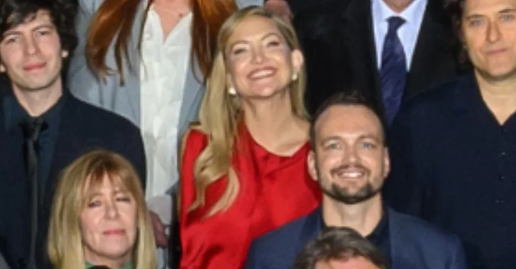 Kate Hudson in the Oscars class photo, wearing a red dress