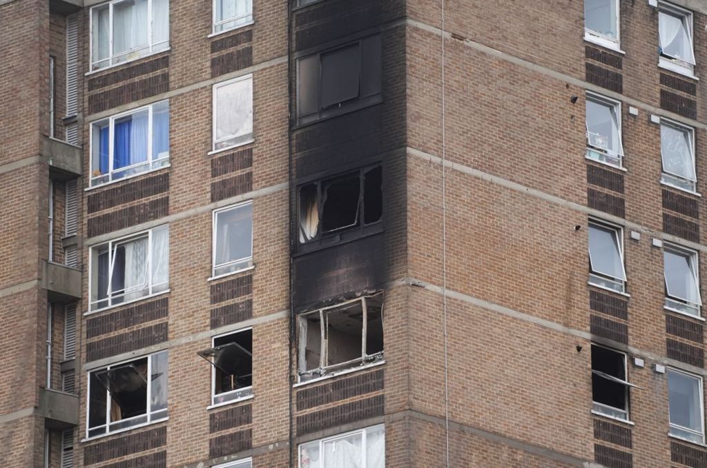 Flats wrecked by the fire blackened by smoke and flame 