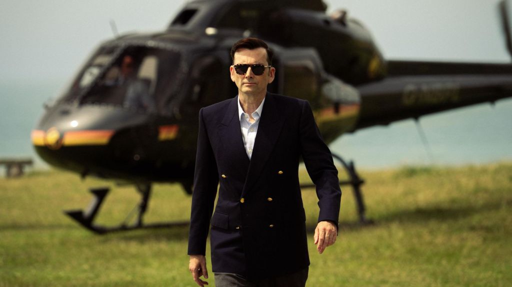 David Tennant's Tony Baddingham striding away from a helicopter