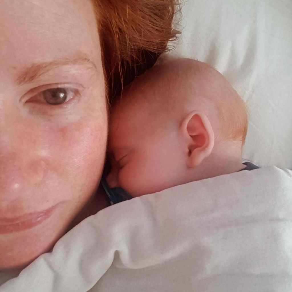 Selfie of a woman with a newborn baby 