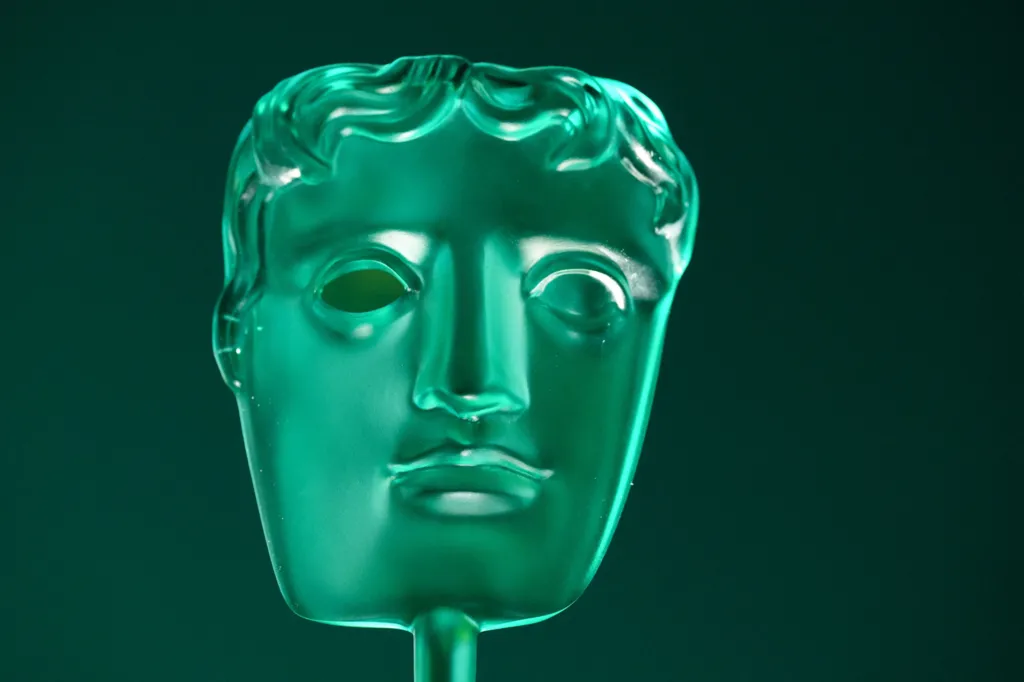 A green Bafta Rising Star Award trophy - of a generic face 