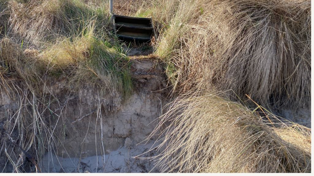 A path to the beach that drops away suddenly with a big drop