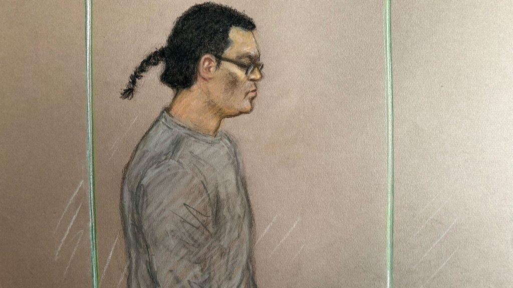 Court sketch of Chan. He is wearing a grey jumper, and his hair is long and tied back
