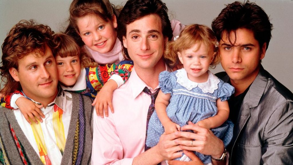 Left to right: Dave Coulier (Joey), Jodie Sweetin (Stephanie), Candace Cameron (D.J.), Bob Saget (Danny), Ashley Olsen (Michelle), John Stamos (Jesse) in Full House