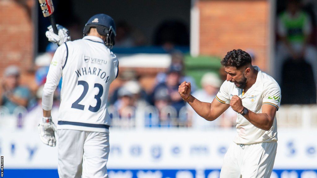 Anuj Dal takes a wicket for Derbyshire