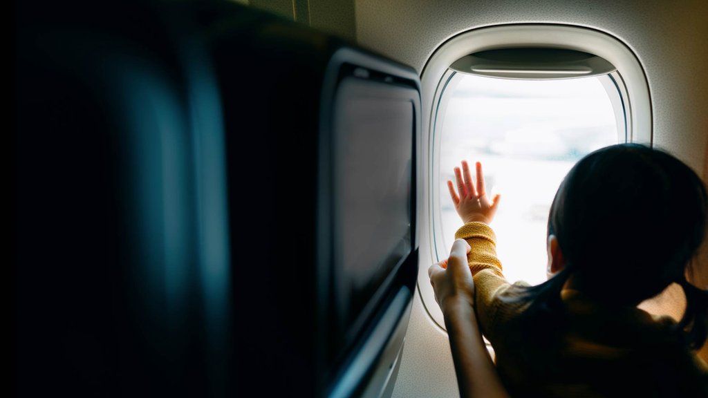 Girl at plane window