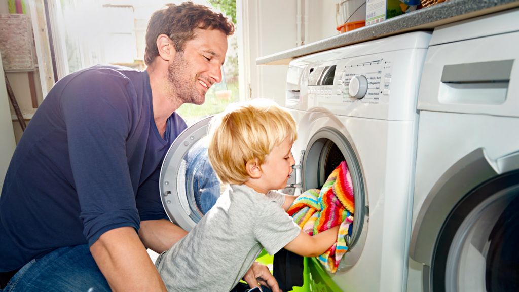 Loading the washing machine with daddy