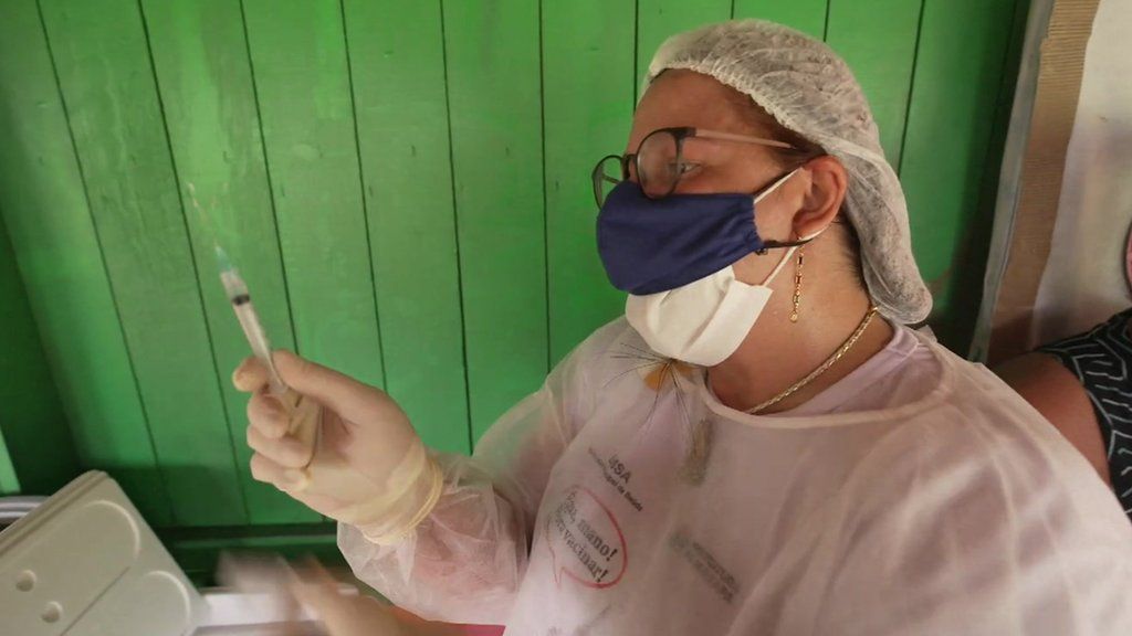 Medic prepares vaccine