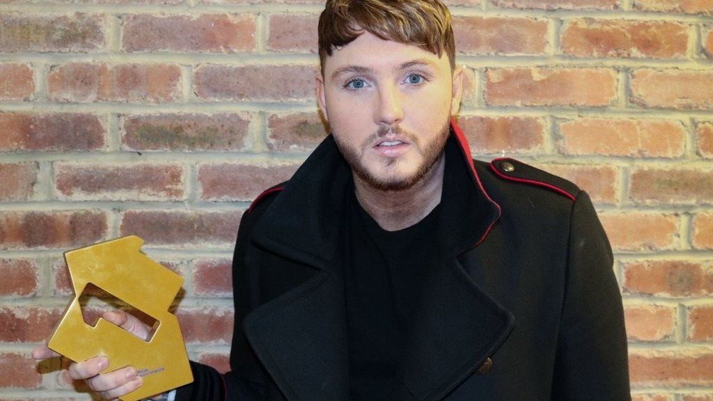 James Arthur with his official charts trophy