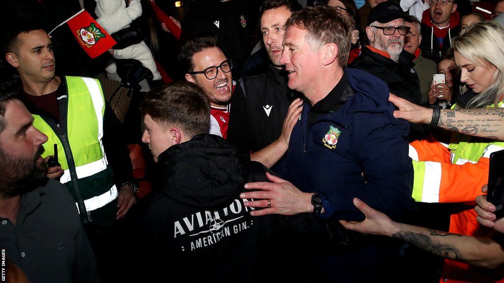 Phil Parkinson, Manager of Wrexham is congratulated by fans