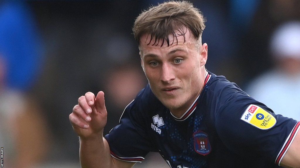 Owen Moxon chases after a ball for Carlisle