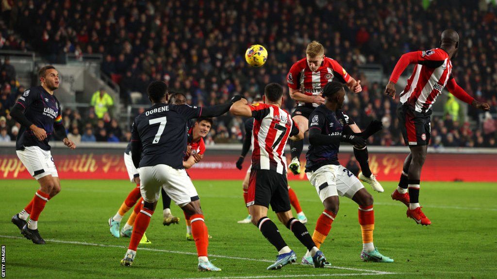 Ben Mee heads the ball