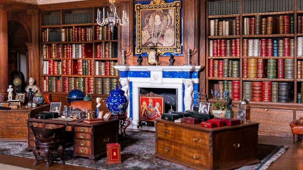 A collection of tiny treasures from Queen Mary's Dolls' House has been put on show to mark the 100th anniversary of its creation.