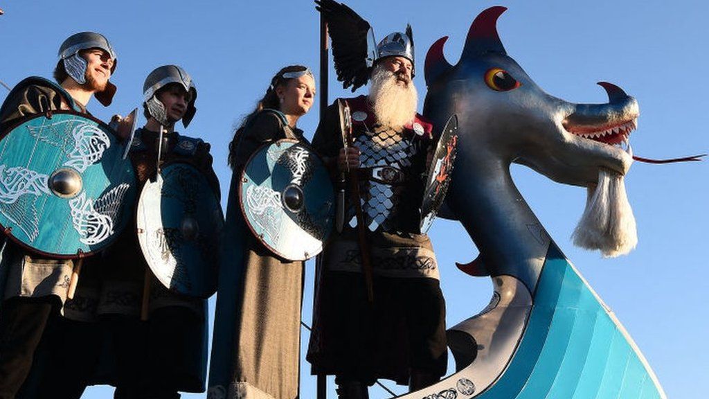 Female members of the Up Helly Aa 'Jarl Squad' prepare to parade through the streets of in Lerwick, Shetland Islands