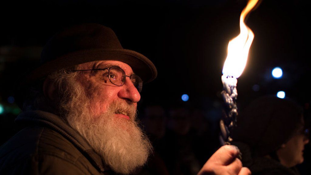 Members and supporters of the Jewish community come together for a candlelight vigil