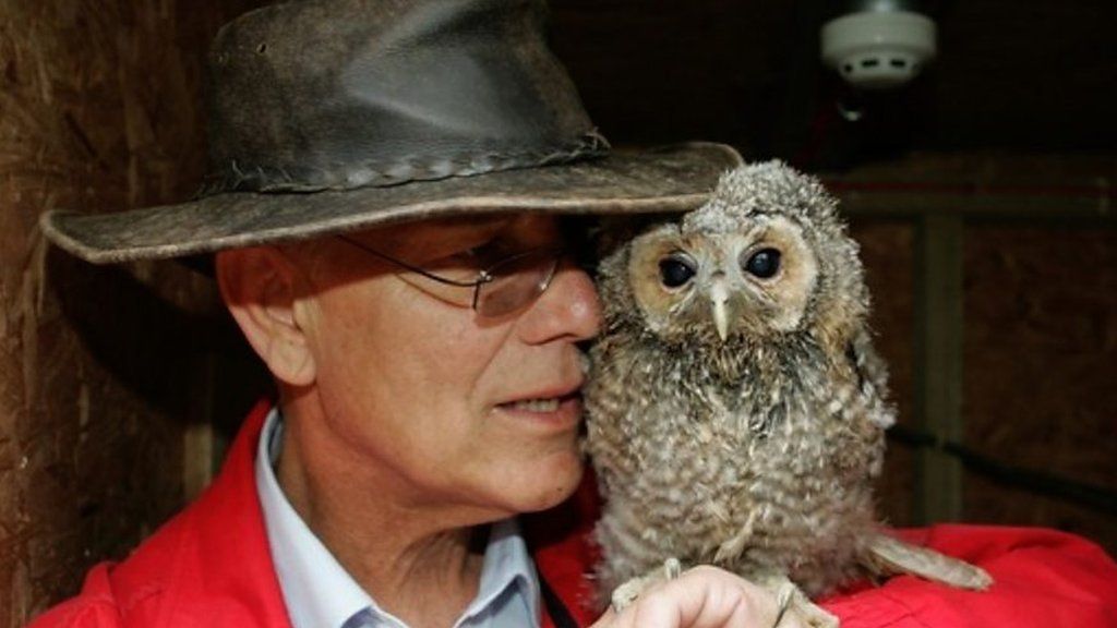 Simon Cowell MBE with an owl