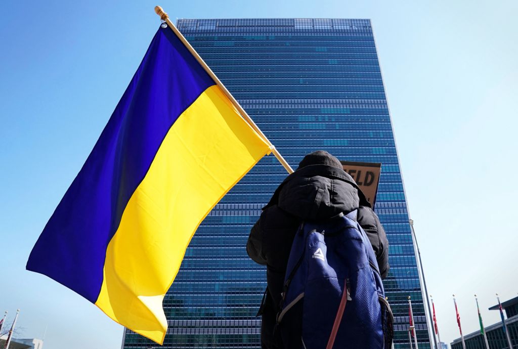 A protester with a Ukrainian flag demonstrates outside the UN headquarters in New York