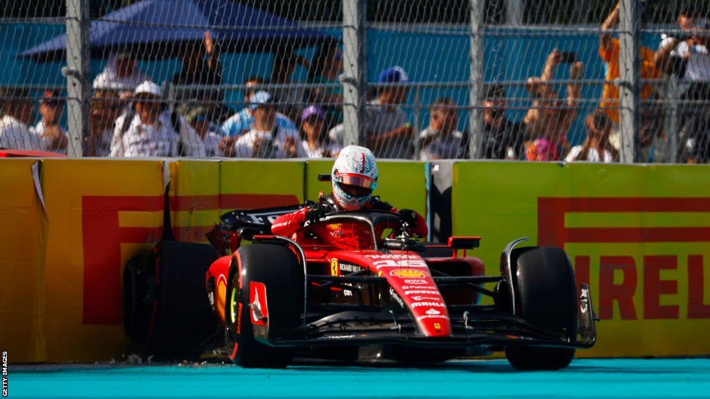 Charles Leclerc climbs from his Ferrari affter crashing in qualifying